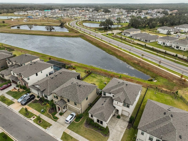 aerial view featuring a residential view and a water view