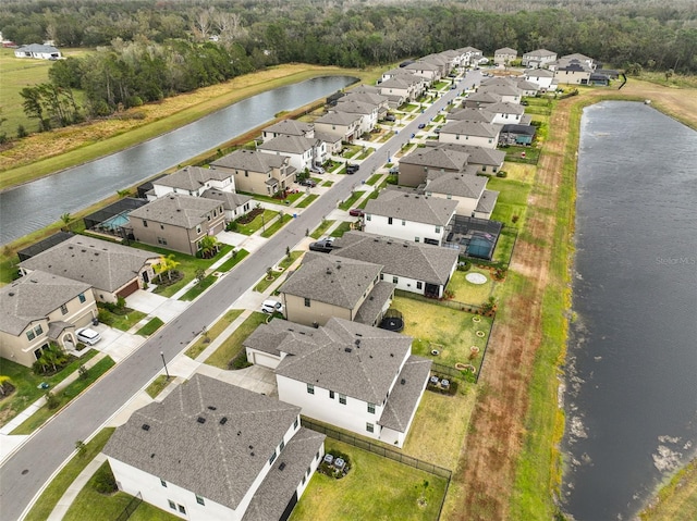 aerial view with a residential view and a water view