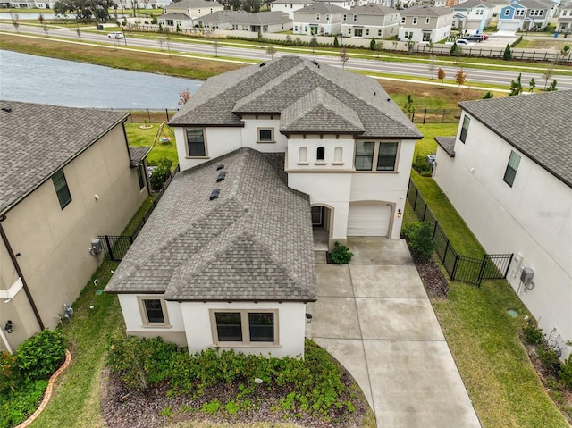 aerial view featuring a water view and a residential view