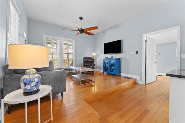 408 E Amelia Ave, Tampa, FL 33602 - living room featuring a ceiling fan and light wood-style flooring
