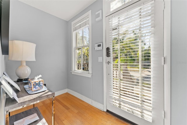 408 E Amelia Ave, Tampa, FL 33602 - doorway featuring baseboards and light wood-type flooring