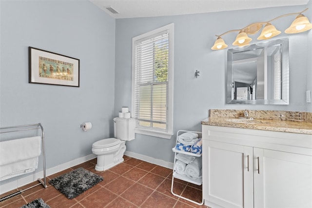 408 E Amelia Ave, Tampa, FL 33602 - bathroom featuring toilet, baseboards, visible vents, tile patterned floors, and vanity