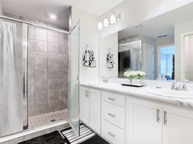 bathroom featuring vanity and walk in shower