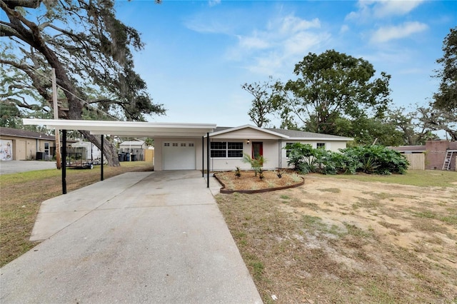 ranch-style home featuring a front lawn and a carport