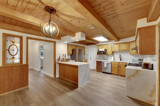 kitchen with hanging light fixtures, stainless steel appliances, beamed ceiling, kitchen peninsula, and light wood-type flooring