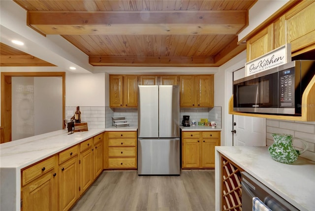 kitchen with tasteful backsplash, light hardwood / wood-style flooring, beam ceiling, and appliances with stainless steel finishes