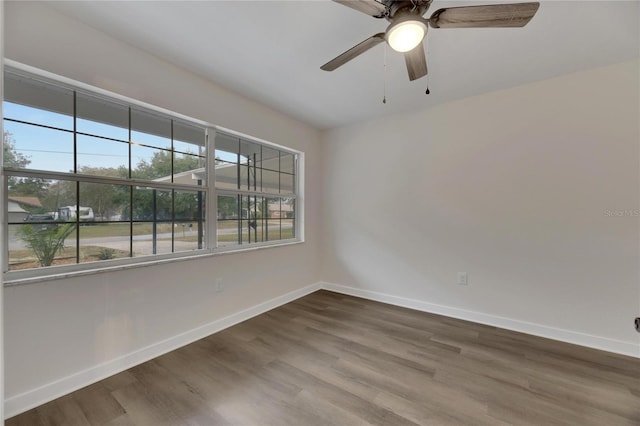 unfurnished room featuring hardwood / wood-style flooring and ceiling fan