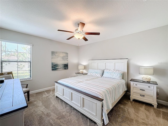 carpeted bedroom with a textured ceiling and ceiling fan