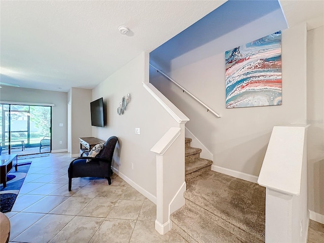 stairs featuring tile patterned floors