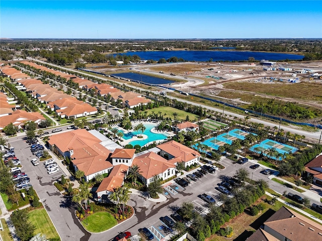 birds eye view of property with a water view