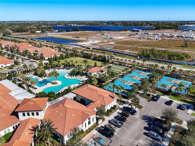 birds eye view of property with a water view