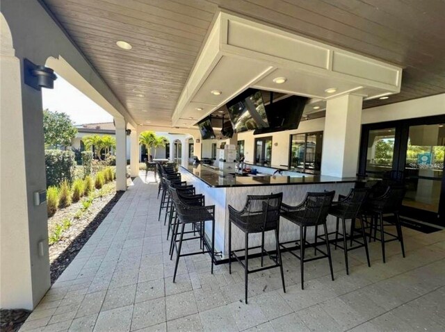 view of patio / terrace featuring an outdoor bar