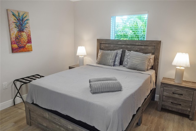 bedroom with hardwood / wood-style flooring