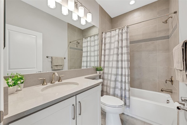 bathroom with toilet, shower / tub combo, and vanity