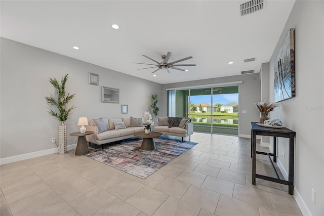 living area with ceiling fan, light tile patterned floors, recessed lighting, visible vents, and baseboards