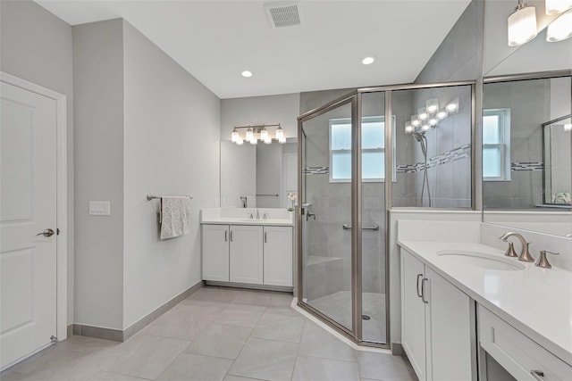 bathroom with two vanities, a sink, visible vents, baseboards, and a stall shower