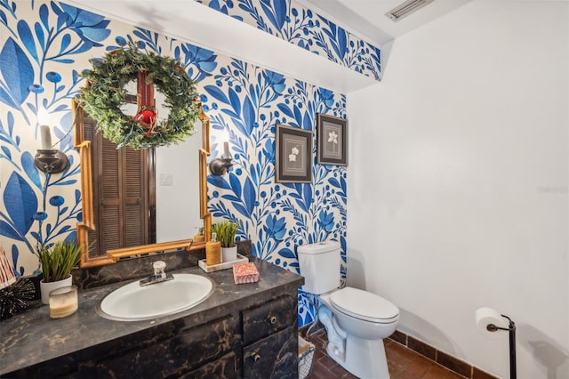 bathroom featuring vanity and toilet