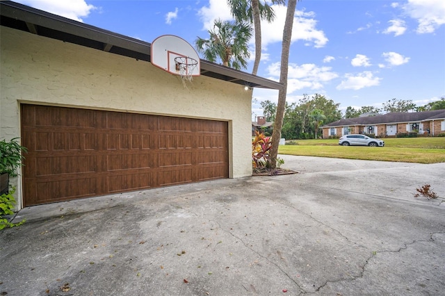 garage with a lawn