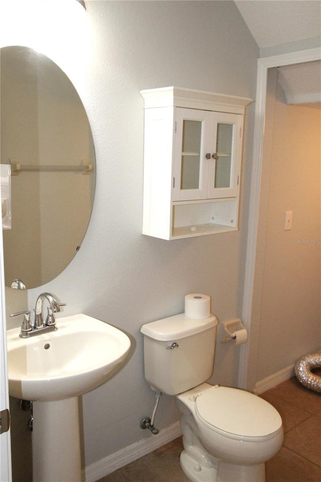 bathroom featuring tile patterned floors and toilet