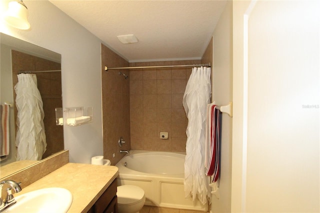 full bathroom featuring vanity, shower / tub combo, a textured ceiling, and toilet