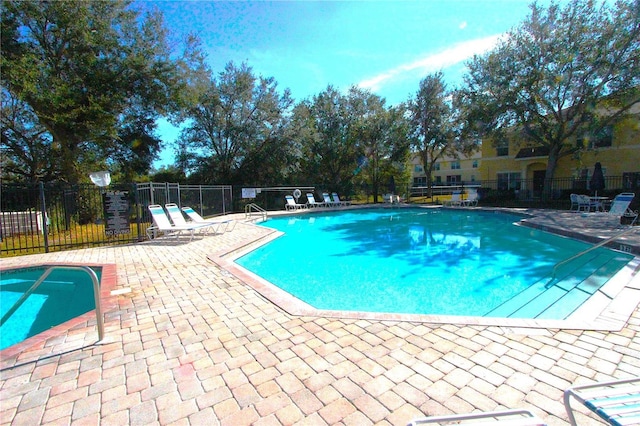 view of pool featuring a patio area