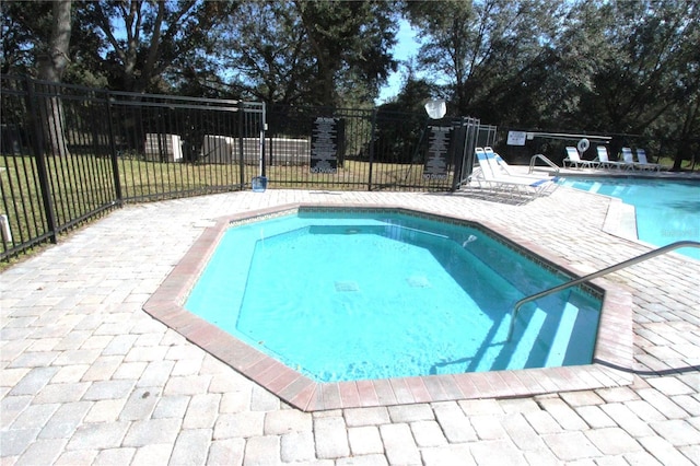 view of pool featuring a patio area