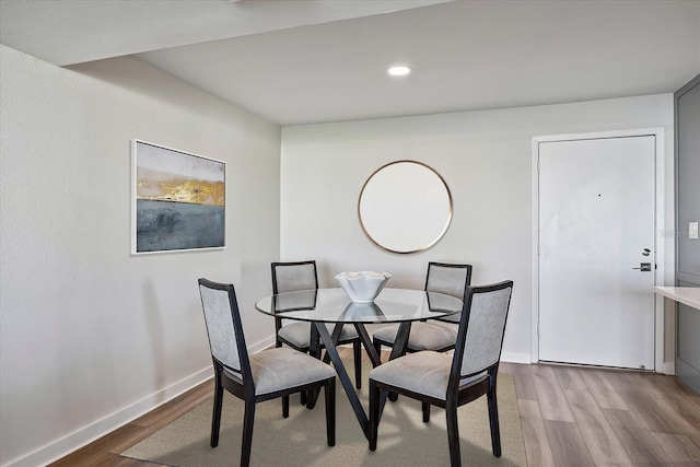 dining space with light wood-type flooring