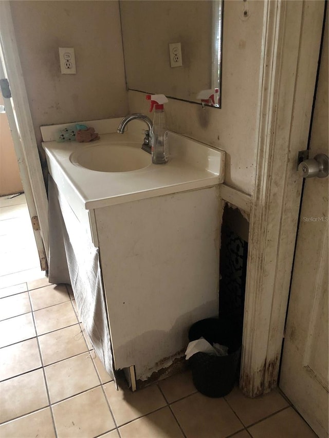 bathroom featuring tile patterned flooring and vanity