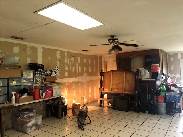 interior space featuring ceiling fan and light tile patterned floors