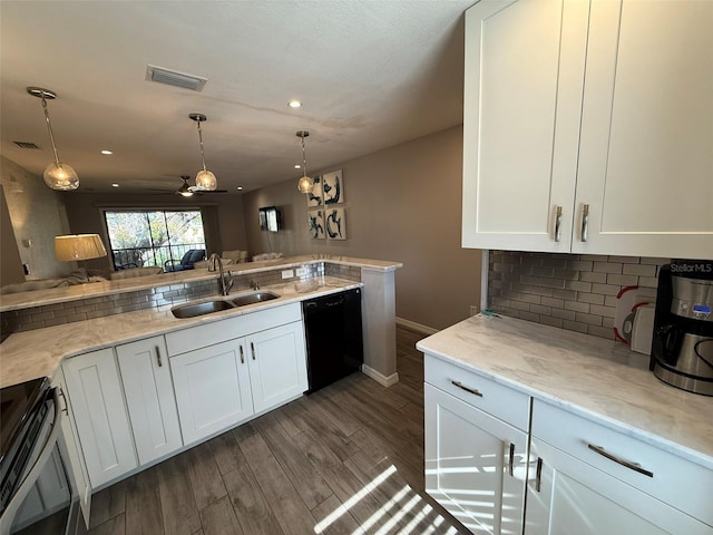 kitchen with white cabinetry, sink, light stone counters, dark hardwood / wood-style floors, and black appliances