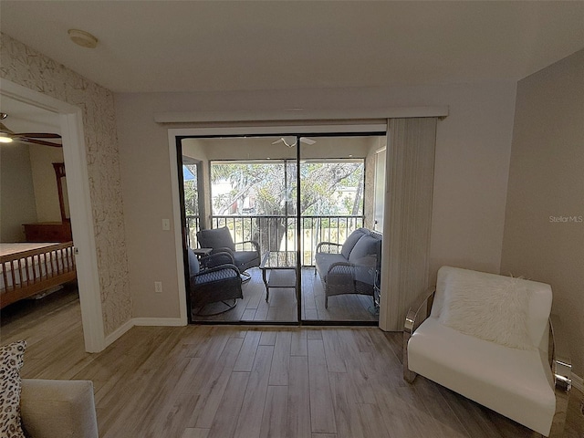 interior space featuring ceiling fan and light wood-type flooring