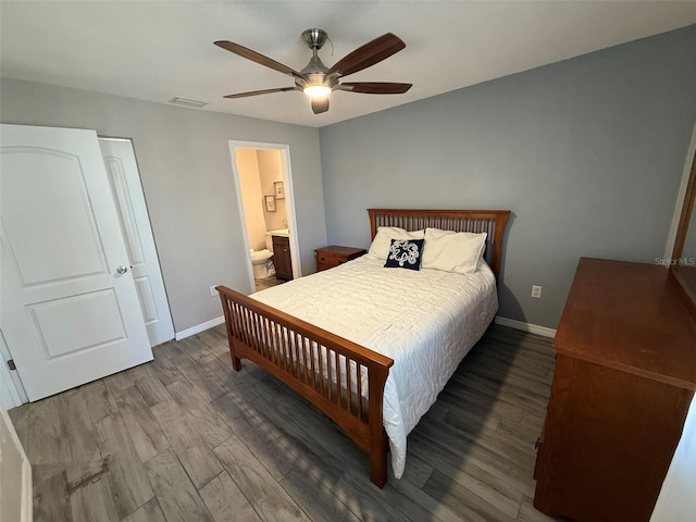 bedroom with ceiling fan, wood-type flooring, and connected bathroom