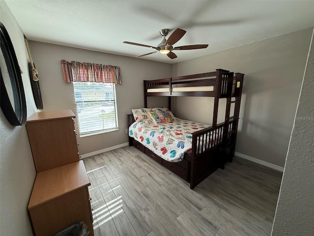 bedroom featuring ceiling fan and light wood-type flooring