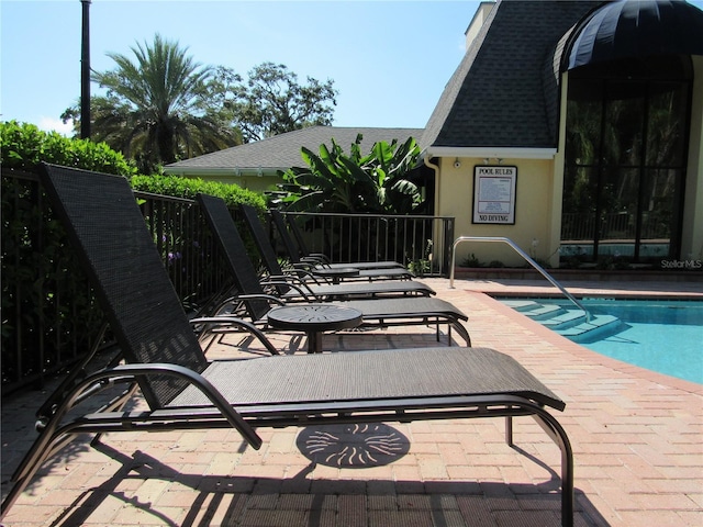 view of pool featuring a patio area