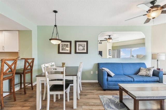 dining area with wood-type flooring