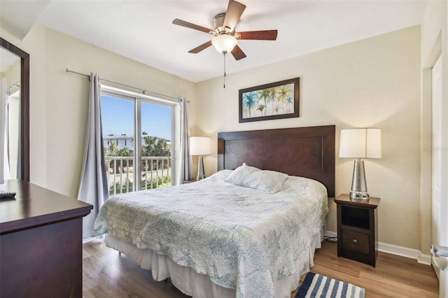 12000 Gulf Blvd Unit 208-S, Treasure Island, FL 33706 - bedroom with wood finished floors, ceiling fan, and access to outside