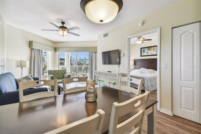 12000 Gulf Blvd Unit 208-S, Treasure Island, FL 33706 - dining room featuring a ceiling fan and wood finished floors