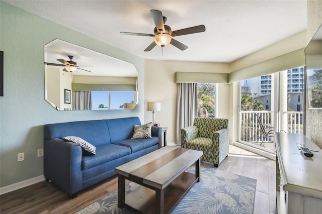 12000 Gulf Blvd Unit 208-S, Treasure Island, FL 33706 - living area featuring a ceiling fan and wood finished floors