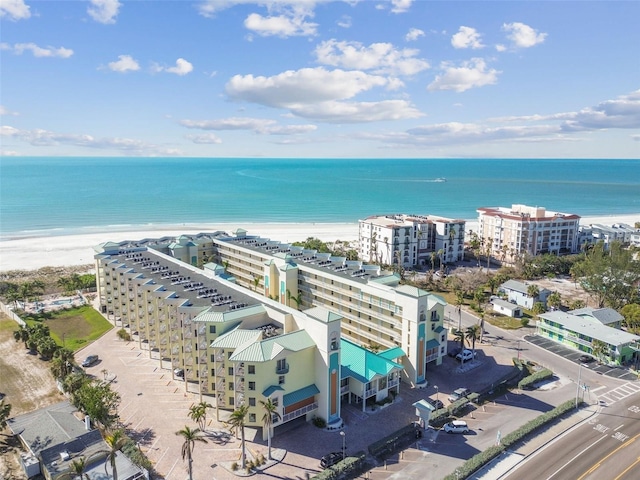 birds eye view of property with a view of the beach and a water view