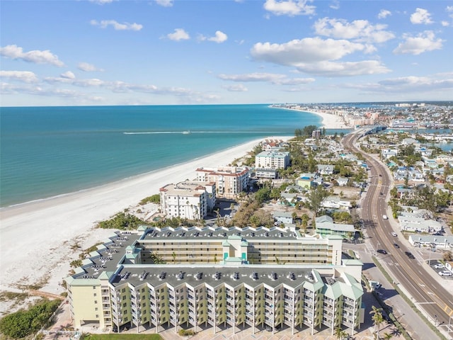 drone / aerial view featuring a water view and a beach view