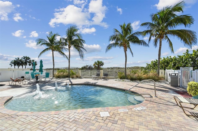 view of swimming pool with a patio area and pool water feature