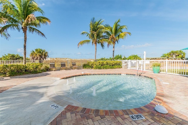 view of swimming pool featuring a patio area