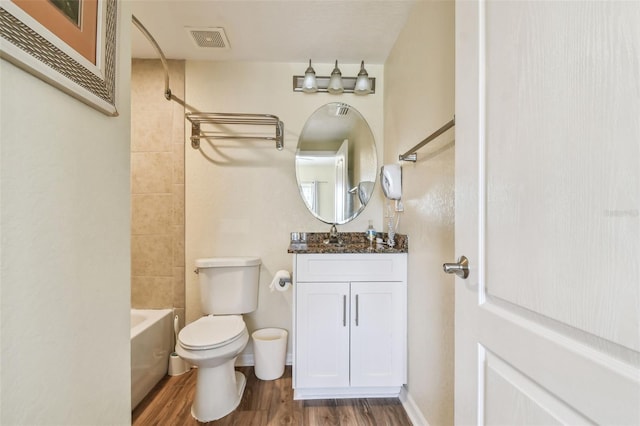 12000 Gulf Blvd Unit 208-S, Treasure Island, FL 33706 - full bath with vanity, wood finished floors, and bathtub / shower combination