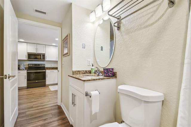 12000 Gulf Blvd Unit 208-S, Treasure Island, FL 33706 - bathroom featuring wood finished floors and vanity
