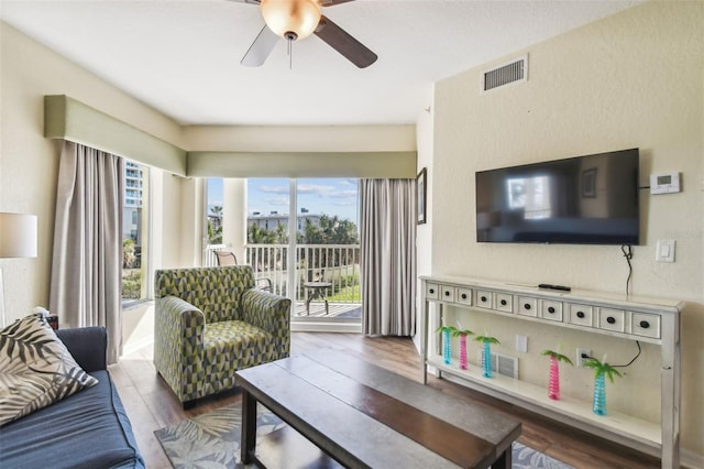 12000 Gulf Blvd Unit 208-S, Treasure Island, FL 33706 - living area with plenty of natural light, ceiling fan, and wood finished floors
