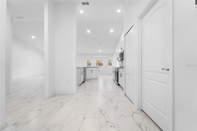 kitchen featuring white cabinetry and stainless steel appliances