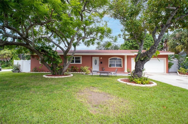 single story home with a garage and a front yard