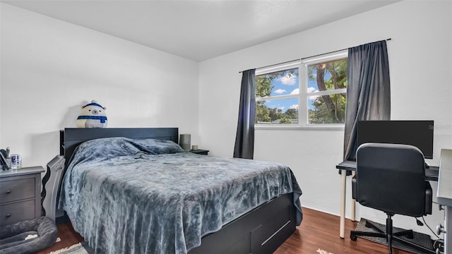 bedroom featuring dark hardwood / wood-style floors