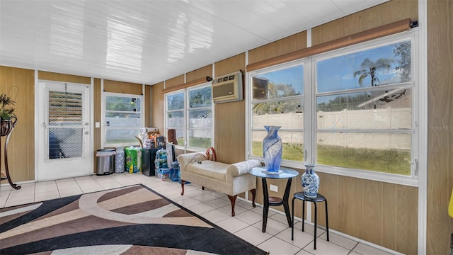 sunroom / solarium with a wall unit AC and plenty of natural light