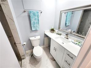 bathroom with vanity and toilet